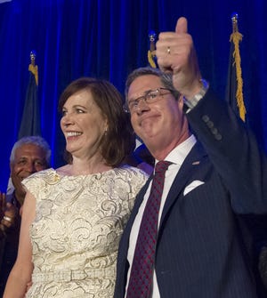 Wendy Vitter, standing with husband David, was confirmed to the federal bench. [Scott Threlkeld/The Advocate]