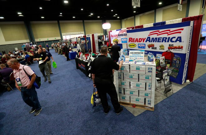 Vendors display hurricane and disaster related wares Thursday at the Governor's Hurricane Conference in West Palm Beach. The week-long conference featured workshops and presentations in emergency preparedness, meteorology and disaster recovery. [Wilfredo Lee/The Associated Press]