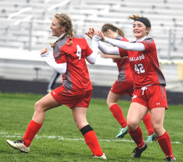 Ballard’s Ellis Giles (4) celebrates scoring Ballard’s first goal against Grinnell with teammate Mya Ehresman during the first half of the Bombers’ 2-1 victory over the Tigers in the third-place game of the Nevada Invitational Saturday at Cub Stadium in Nevada.