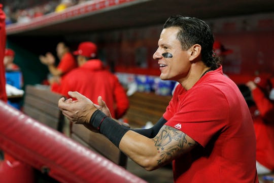 Cincinnati Reds second baseman Derek Dietrich (22) cheers from the bench in the 10th inning of the MLB National League game between the Cincinnati Reds and the Chicago Cubs at Great American Ball Park in downtown Cincinnati on Wednesday, May 15, 2019. The Reds won 6-5 on a walk-off single by Yasiel Puig in the bottom of the 10th inning.