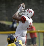 Wayne's L'Christian Smith catches a touchdown pass during the Warriors  win over Moeller.