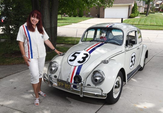 Lynn Anderson of Clinton Township stands by her prized possession, a 1965 replica of Herbie the Love Bug, in 2015. </div>