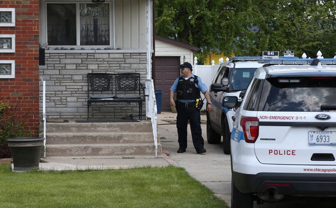 Chicago police watch over a home in Chicago, Wednesday, May 15, 2019, where Marlen Ochoa-Lopez was strangled and her baby cut from her womb, police and family members said.