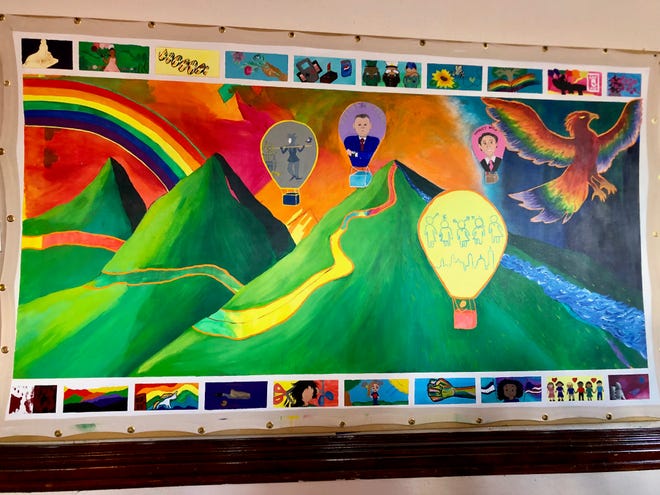 This mural, displayed at the Shenandoah LGBTQ Center on May 14, 2019, depicts the history of the LGBT movement at large.