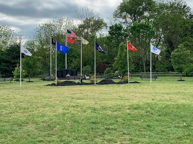 Medford installed five new flag poles to honor each branch of the U.S. Military last week in Freedom Park. The township will dedicate two new war monuments at its Memorial Day celebration May 27. [CONTRIBUTED]