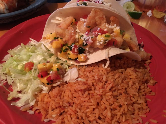 Shrimp tacos with Spanish rice is a lighter Mexican dish at Sam Diego's Mexican Cookery and Bar in Hyannis. [GWENN FRISS/CAPE COD TIMES]