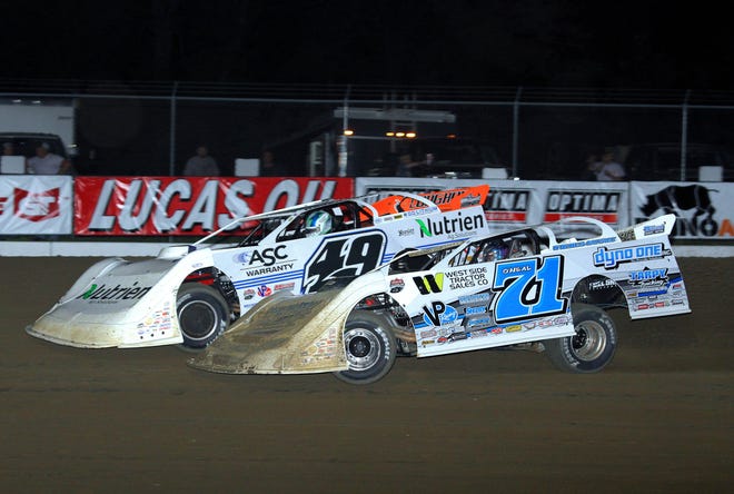 Hudson O'Neal (71) passes Jonathan Davenport on his way to the win in Thursday's Lucas Oil Late Model Dirt Series feature at 34 Raceway. [John Vass/Special to The Hawk Eye]