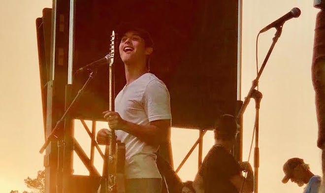 Laine Hardy smiles before his local fans on stage after his recent homecoming parade in Livingston Parish.