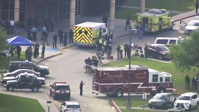 In this Friday, May 18, 2018 file image taken from video, emergency personnel and law enforcement officers respond to a high school near Houston after an active shooter was reported on campus, in Santa Fe, Texas. A year after the mass shooting at Santa Fe High School near Houston that remains one of the deadliest in U.S. history, Texas lawmakers are close to going home without passing any new gun restrictions, or even tougher firearm storage laws that Republican Gov. Greg Abbott had backed after the tragedy. [KTRK-TV ABC13 via AP, File]