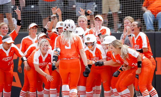OSU celebrates the home run of Samantha Show in the 7th inning during a NCAA regional softball game between the University of Oklahoma and Tulsa in Stillwater, Okla., Friday, May 17, 2019. Photo by Sarah Phipps, The Oklahoman