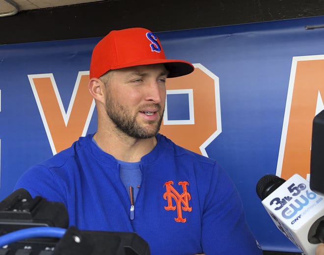 Syracuse's Tim Tebow speaks with reporters prior to Thursday's International League game. The Mets farmhand has struggled to find his rhythm at the plate but has begun to come with hits in six of the last seven games. [John Kekis/The Associated Press]