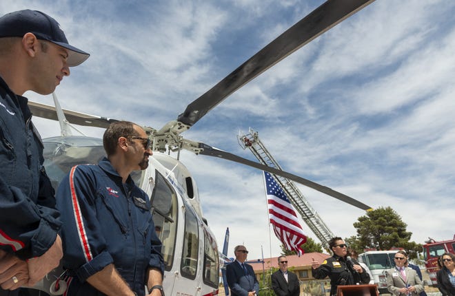 Mercy Air staff is introduced during a ceremony to officially open their new base in Barstow on Friday. The air ambulance service has been operating since February. [James Quigg, Daily Press]
