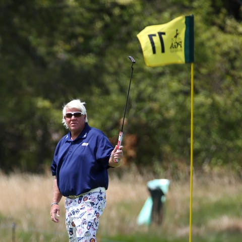 John Daly reacts to his putt on the 11th hole...