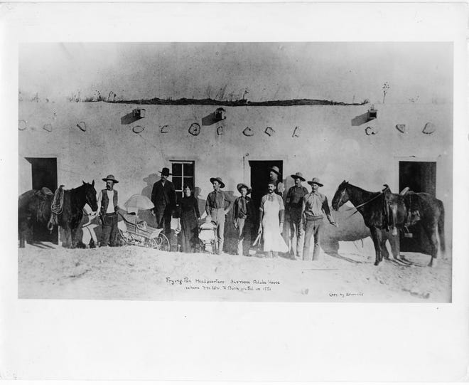 Cowhands stand in front of the Adobe headquarters of the Frying Pan Ranch near Tecovas Spring. The picture is mistaking dated, "1881" but the date is probably 1884. [Photograph curtesy of the Panhandle-Plains Museum, Canyon]
