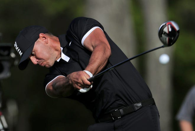 Brooks Koepka drives off the 12th tee during the third round of the PGA Championship on Saturday at Bethpage Black in Farmingdale, N.Y. [AP Photo/Julio Cortez]