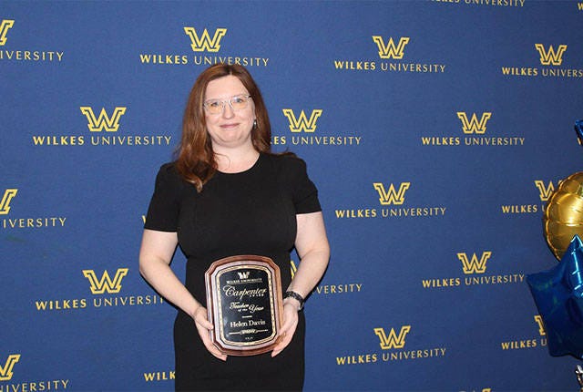EXCEPTIONAL TEACHER — Helen (Holtzclaw) Davis poses with the Carpenter Award for Teaching, considered Wilkes University’s highest honor for teaching. The award recognizes an outstanding member of the faculty and includes a $1,000 award and framed certificate. (Contributed)