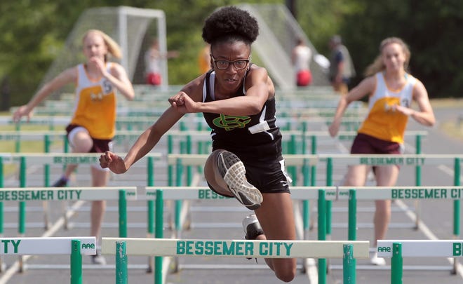 Bessemer City's Ja'Ciya Guthrie competes in the 100 meter Hurdles during the Southern Piedmont 1A Track and Field Championships held Monday afternoon, April 29, 2019, at Bessemer City High School. [Mike Hensdill/The Gaston Gazette]