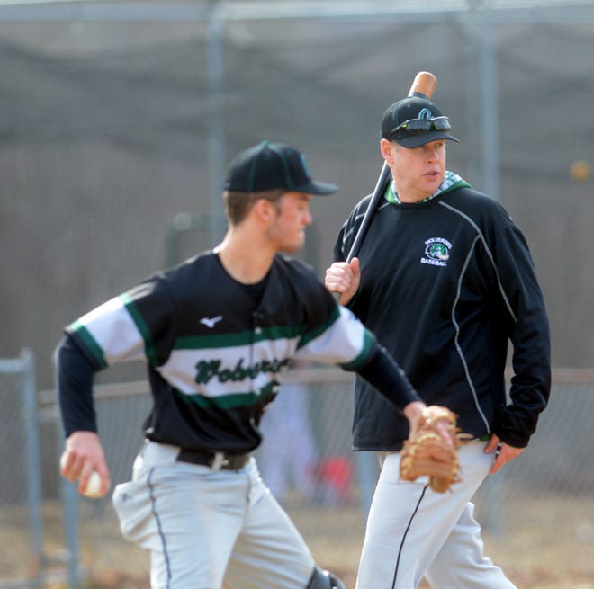 Griswold baseball coach Mike Jamieson, pictured hitting infield practice as Andrew Koziol catches, has guided the Wolverines to nine straight wins and the ECC Division IV title. [Aaron Flaum/NorwichBulletin.com