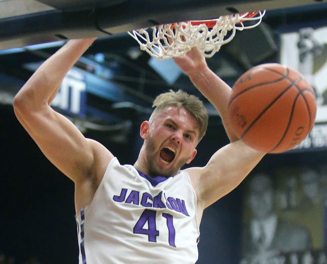 Jackson´s Logan Hill dunks the ball during the third quarter of a Division I regional semifinal game against Medina at the James A. Rhodes Arena in Akron on Thursday, March 16, 2017. (CantonRep.com / Scott Heckel)