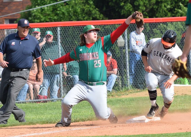 Barnesville High’s Zach Thompson attempts to make a play at third base as Ridgewood’s Chase Minet is safe with a stolen base during Monday’s Division III district semifinal game at Muskingum University in New Concord. Ridgewood advanced to the district championship game with a 7-1 victory.