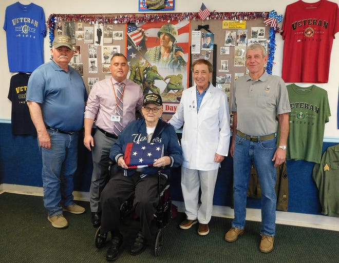 An American flag was presented to Mark Scalise, administrator of FoltsBrook Center for Nursing and Rehabilitation, to be flown at the Herkimer center. Jim Walczak, director of outpatient therapy at FoltsBrook, said he presented the flag on behalf of the veterans who attend physical therapy sessions there. Scalise expressed thanks for the flag and to the veterans for their service and for the sacrifices they made. From left are Robert Rowan, a Vietnam veteran; Scalise, Merrill Spanfelner, World War II veteran; Walczak, and Don Bronson, Vietnam veteran. [DONNA THOMPSON/TIMES TELEGRAM]