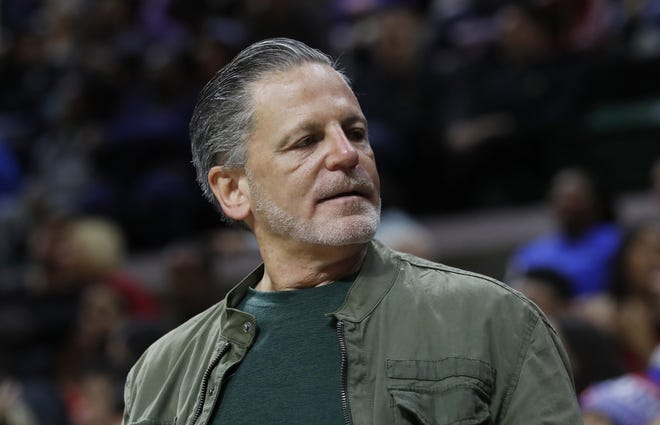 In an Oct. 12, 2018 file photo, Quicken Loans and Rock Ventures founder Dan Gilbert is seen during a basketball game in East Lansing, Mich. Gilbert is starting a ballot drive as a "failsafe" in case Michigan's Republican-led Legislature and Democratic Gov. Gretchen Whitmer don't enact legislation to cut the country's highest auto insurance premiums. Quicken Loans vice president of government affairs Jared Fleisher said Monday that a ballot committee, Citizens for Lower Auto Insurance Rates, will be created this week. (AP Photo/Carlos Osorio, File)