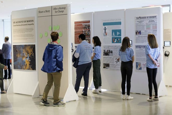 The exhibit "An Account of Boston: Local Stories of Economic Inequality" opened at the Edward M. Kennedy Institute on Sunday, May 19, 2019. Michael Dwyer/Milton Academy photo