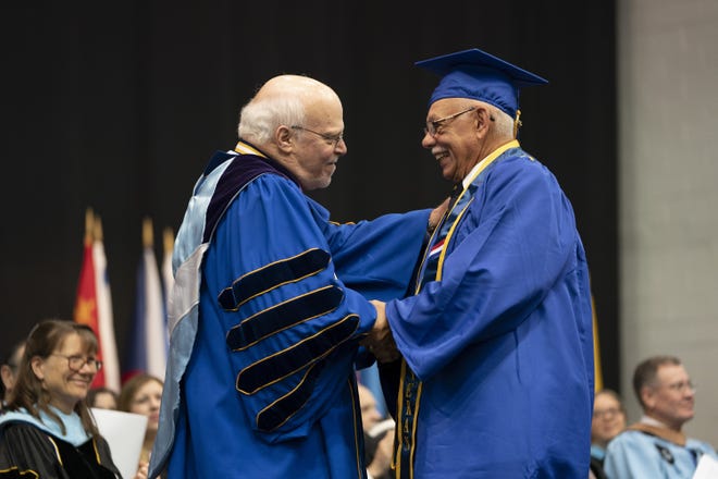 Anthony Rondello, right, receives his degree from Hofstra University on Long Island, New York, Sunday. [Courtesy Hofstra University]