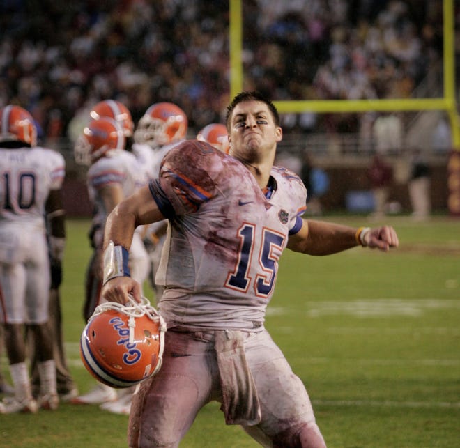 In this photo, quarterback Tim Tebow excites the crowd after the Florida Gators received another first down in the final moments of the second quarter at Florida State on November 29, 2008. [Gainesville Sun File]