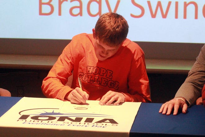 Ionia High School senior Brady Swinehart signs to play basketball at Hope College on Monday, May 20 at the Ionia Educational Center, 250 E. Tuttle Road, in Ionia. [EVAN SASIELA/SENTINEL-STANDARD]