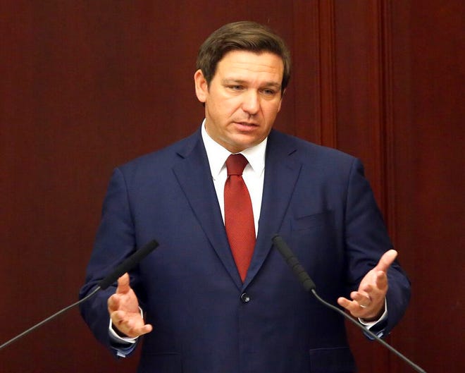 FILE- In this March 5, 2019 file photo. Florida Gov. Ron Desantis gives his state of the state address on the first day of legislative session, in Tallahassee, Fla. DeSantis is going to Israel with a large contingent of business leaders. Thatâ€™s not surprising, especially as the GOP woos Jewish voters ahead of an important election year. But holding a meeting with the state's three independently elected Cabinet members while he's there has raised concerns about violating the state's open-meeting laws. (AP Photo/Steve Cannon, File)