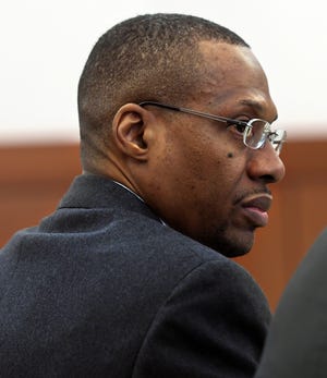 Marcus Cooper, a former University of Massachusetts Medical School doctor accused of using his cellphone to photograph a woman in an on-campus bathroom, stands trial at Cenrtral District Court. [T&G Staff/Allan Jung]