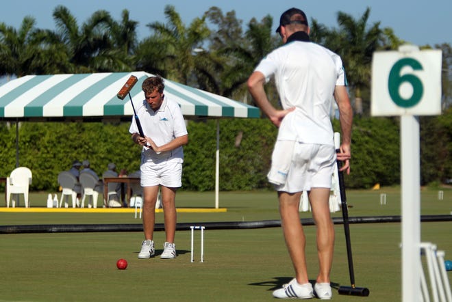 In 2012, Duncan Dixon, left, and Hamish McIntosh compete in the International Golf Croquet Championship at the National Croquet Center. Golf croquet is returning to the center in July.