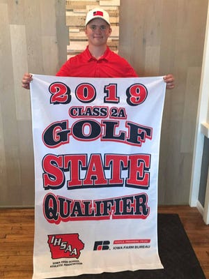Roland-Story’s Nicke Stole holds up his Class 2A state qualifier banner after qualifying individually for the boys’ state golf tournament May 17 at the 2A district meet in Carroll. Submitted Photo.