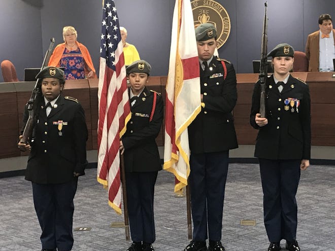 Students from the Booker High School JROTC program lead the Pledge of Allegiance at Tuesday afternoon’s Sarasota County School Board meeting. [Herald-Tribune staff photo / Ryan McKinnon]