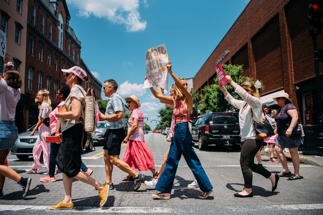 Protesters march across Broughton Street on Tuesday during the Stop the Ban protest.The march was one of hundreds across the country in protest of recent restrictive abortion bills signed into law by multiple states in the last few weeks. [Courtesy of Kendra Frankle]
