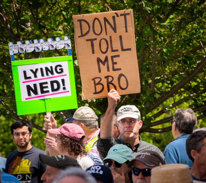 Protesters have gather outside the state Capitol to rally against a proposal to put electronic tolls on the state's highways Saturday, May 18, 2019 in Hartford, Conn. Demonstrators on Saturday called the plan another tax increase state residents can't afford. They held "no tolls" signs and wore "no tolls" shirts as they criticized Democratic Gov. Ned Lamont's plan to raise money for highway improvements.(Melanie Stengel/Hartford Courant via AP)
