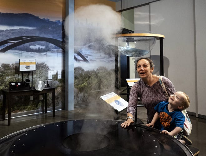 Griffin Heilveil, 3, and his mother, Johanna Owens, look at one of the displays in the Thinkery's new exhibit on Wednesday. The exhibit opens Saturday and will be in the revolving exhibit space at the children's museum for about a year. [Rodolfo Gonzalez for Statesman)
