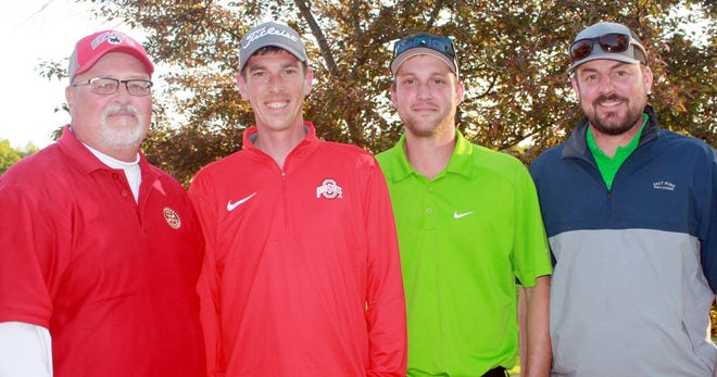 Larry Miller, chairman of the Byesville Scholarship Golf Scramble, and winning team members, Jake Koenig, Mathew Koenig and Adam Sikora.