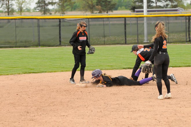 Blissfield’s Cendell Burgermeister beats a tag from Hudson’s Haley Jones (7) to second base during a rundown in Tuesday’s LCAA doubleheader.