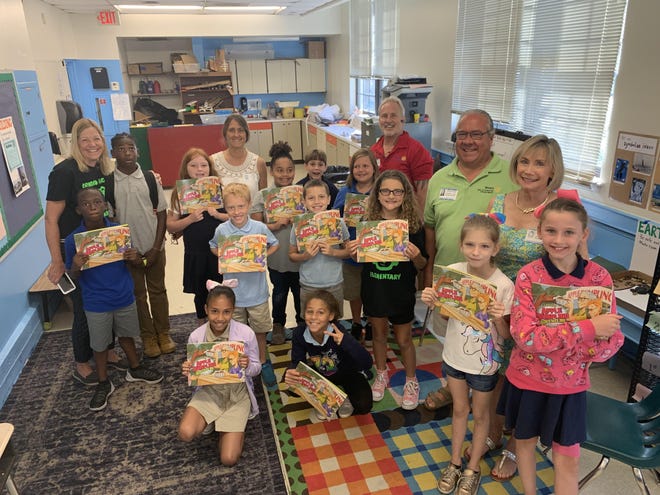 Students and Rotarians participate in the Ormond Beach Elementary Reading Buddies Program. [Photo provided]