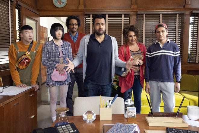 This image released by NBC shows, from left, Joel Kim Booster, Poppy Liu, Samba Schutte, Kal Penn, Diana Marie Riva and Moses Storm in a scene from "Sunnyside." On Thursday night, where NBC sitcoms including "Cheers" and "Friends" ruled back in the 1980s and '90s, the network will introduce newcomers "Perfect Harmony" and "Sunnyside" to join returning comedies "Superstore" and "The Good Place" this fall. (Photo by: Colleen Hayes/NBC)