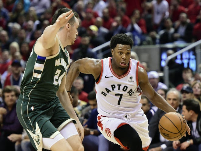 Toronto Raptors guard Kyle Lowry (7) drives for the basket as Milwaukee Bucks guard Pat Connaughton defends during Game 4 of the NBA Eastern Conference finals on Tuesday night in Toronto. [FRANK GUNN/THE ASSOCIATED PRESS]