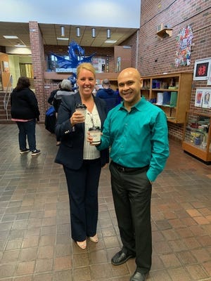 Leominster Superintendent of Schools Paula Deacon and Frances Drake Principal Andres Vera show their cups of coffee. [SUBMITTED PHOTO]