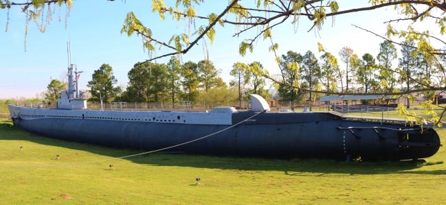 The USS Batfish, which was launched in 1943 and holds the record as the most successful submarine-killing sub, is a museum on a grassy depression above a river bank in Muskogee. [Beth Stephenson]