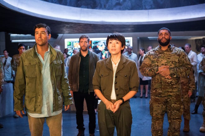 O’Shea Jackson Jr. (right) is part of the military-science team with Kyle Chandler, Thomas Middleditch, and Ziyi Zhang. [Warner Bros.]