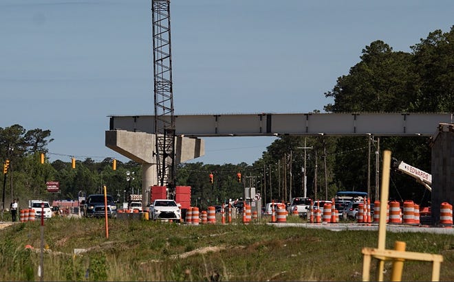 A problem with steel girders being put into place on the Slocum Flyaway Bypass caused another traffic problem Wednesday morning. [KEITH BYERS/GATEHOUSE MEDIA]
