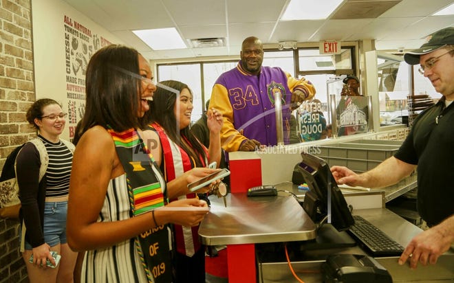 NBA legend Shaquille O'Neal bought pizzas for customers during surprise visit at a local Papa John's last Thursday in Milwaukee. O'Neal recently joined the Papa John's Board of Directors and is a franchise owner. [Darren Hauck/AP Images for Papa John's]