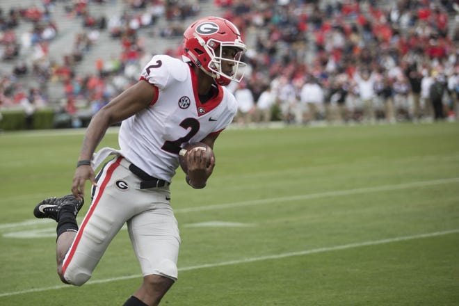 Georgia quarterback Dwan Mathis scores a touchdown during the second half of the spring G-Day game in April. [Photo/ Jenn Finch, The Athens Banner-Herald]
