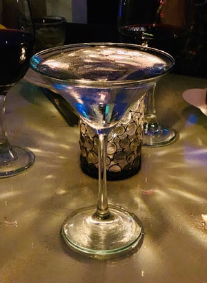 Specialty drinks like this cucumber and basil martini lend an air of old world charm at Jacks. [JANE REED WILSON]
